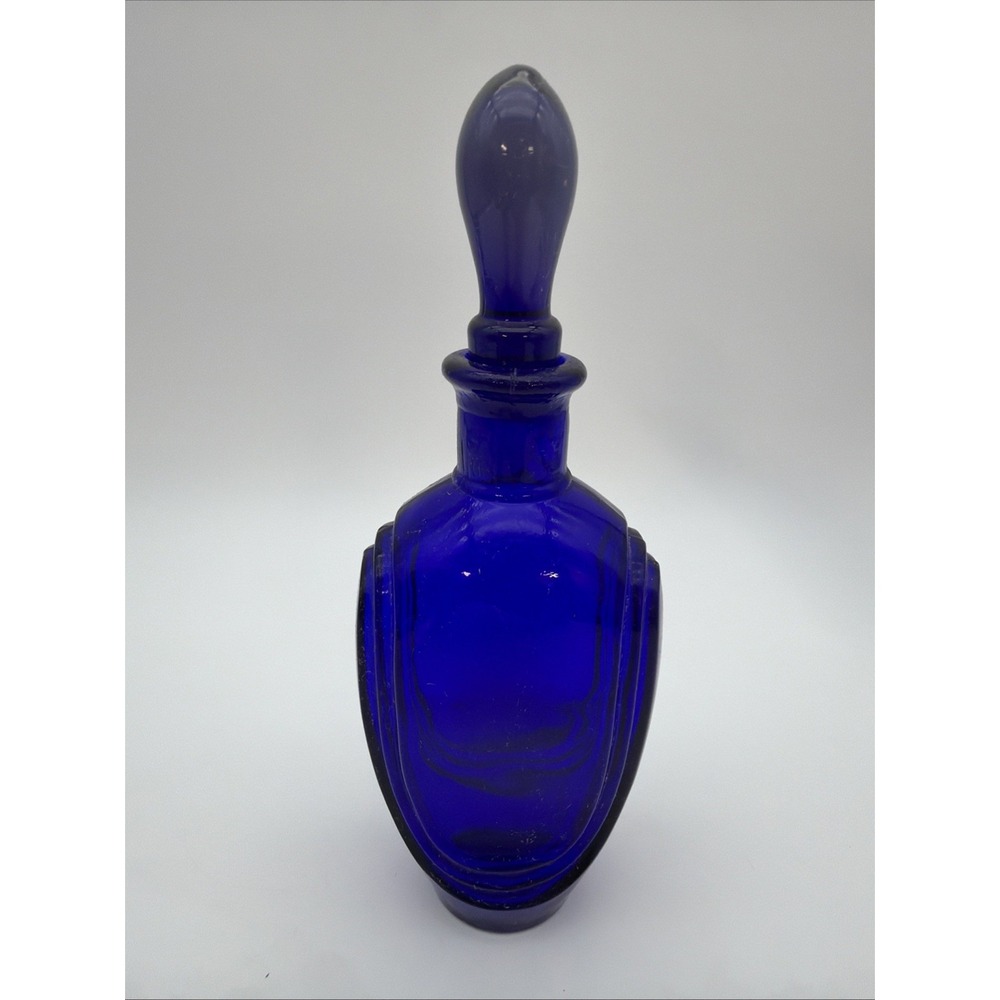 vintage cobalt blue glass bottle with a matching stopper